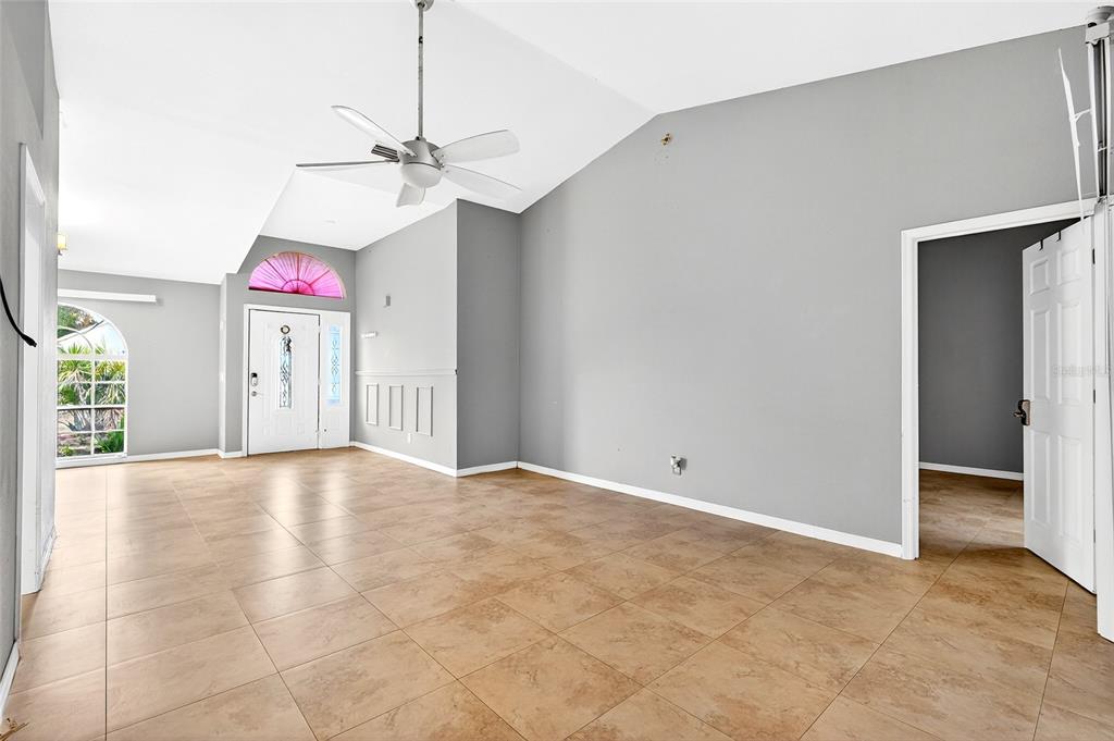 7839 Southwest 63rd Ave Road Ocala, FL 34476 - Photo 13 of 41 a view of an empty room with chandelier fan