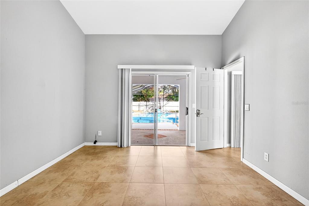 7839 Southwest 63rd Ave Road Ocala, FL 34476 - Photo 15 of 41 an empty room with windows