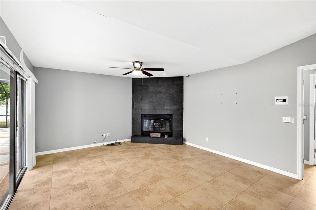 7839 Southwest 63rd Ave Road Ocala, FL 34476 - Photo 25 of 41 a view of an empty room with a fireplace