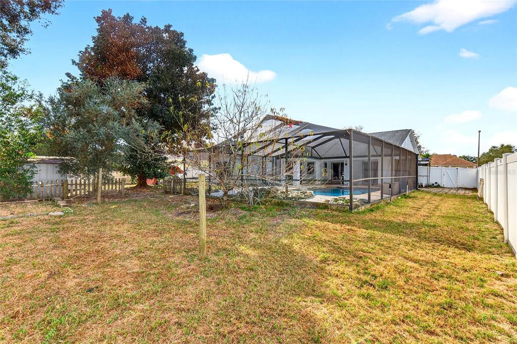 7839 Southwest 63rd Ave Road Ocala, FL 34476 - Photo 38 of 41 a house view with swimming pool in front of it