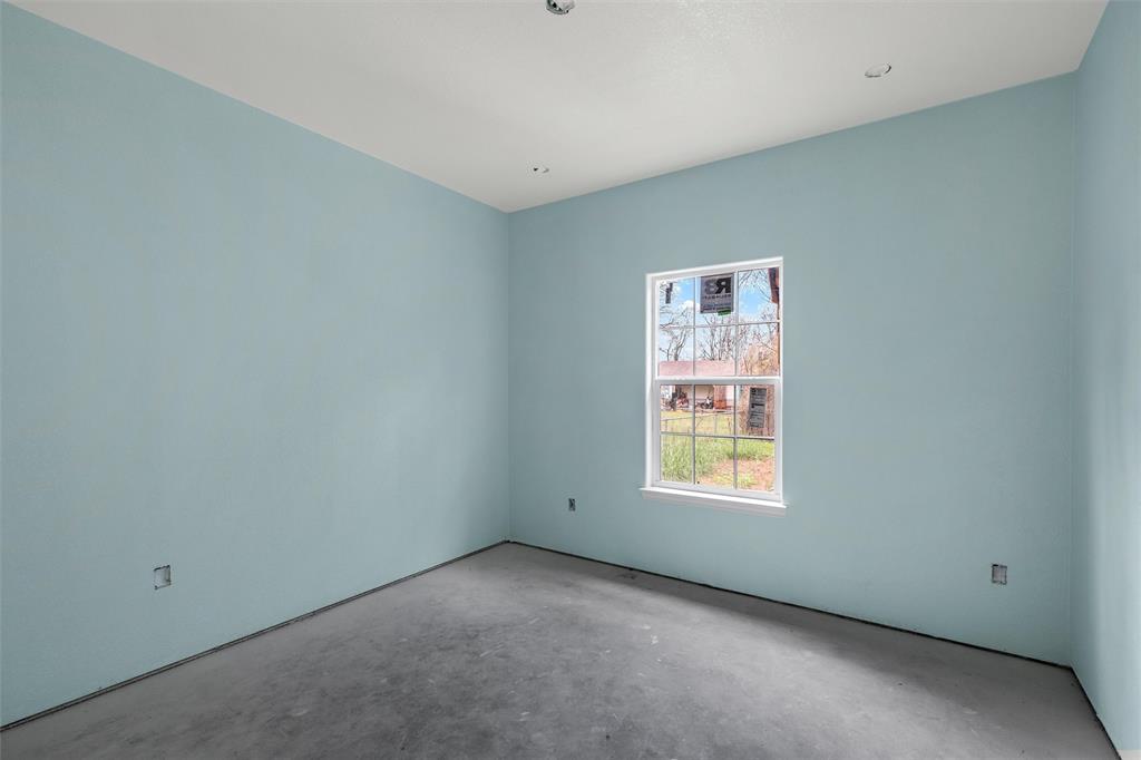 211 Lopez Street Bellmead, TX 76705 - Photo 11 of 15 a view of an empty room with windows