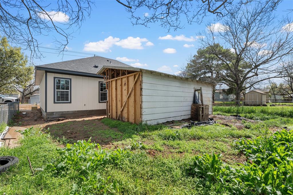 211 Lopez Street Bellmead, TX 76705 - Photo 14 of 15 a view of a house with a yard
