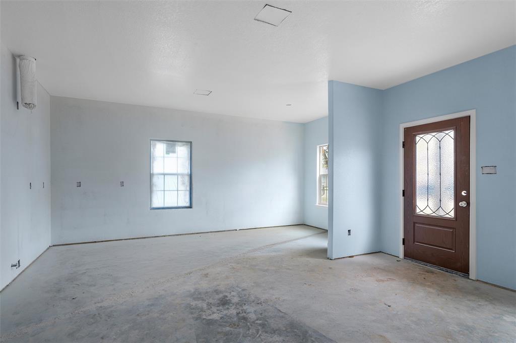 211 Lopez Street Bellmead, TX 76705 - Photo 3 of 15 a view of an empty room with a window