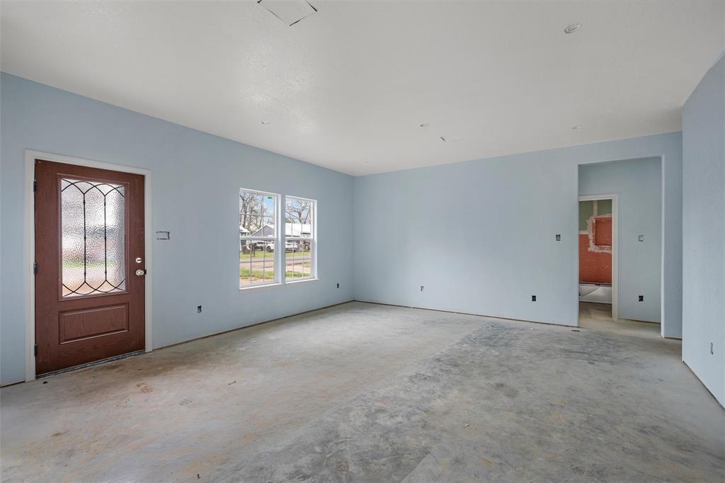 211 Lopez Street Bellmead, TX 76705 - Photo 4 of 15 a view of an empty room with windows