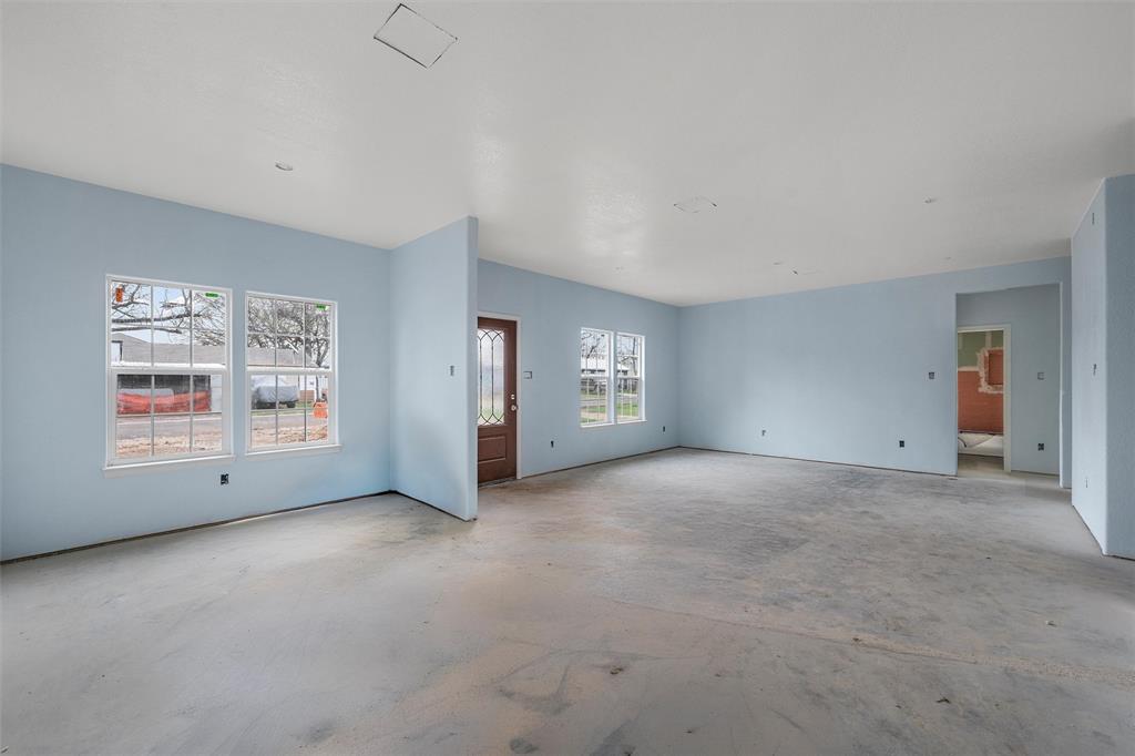211 Lopez Street Bellmead, TX 76705 - Photo 6 of 15 a view of an empty room with a window