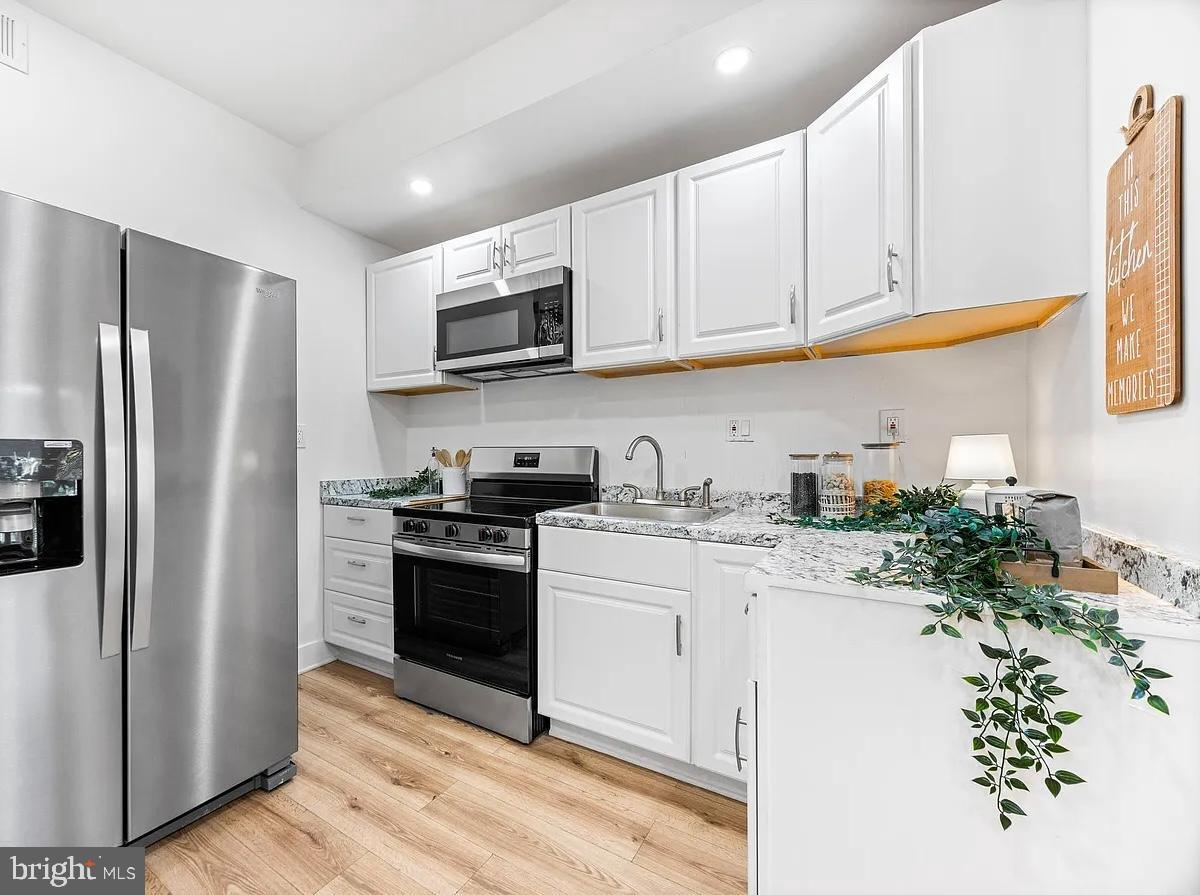 2542 Harford Road, Unit A Baltimore, MD 21218 - Photo 2 of 11 Modern kitchen with sleek finishes.