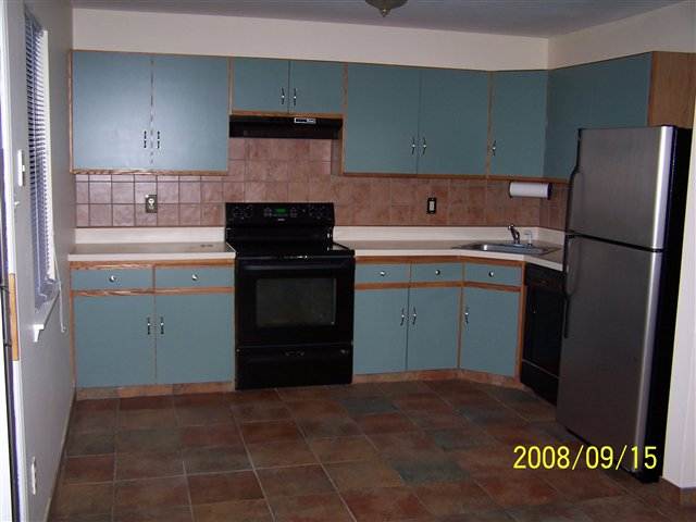 2606 Falcon Court, Unit 2606 Mays Landing, NJ 08330 - Photo 4 of 8 a kitchen with a sink and a refrigerator