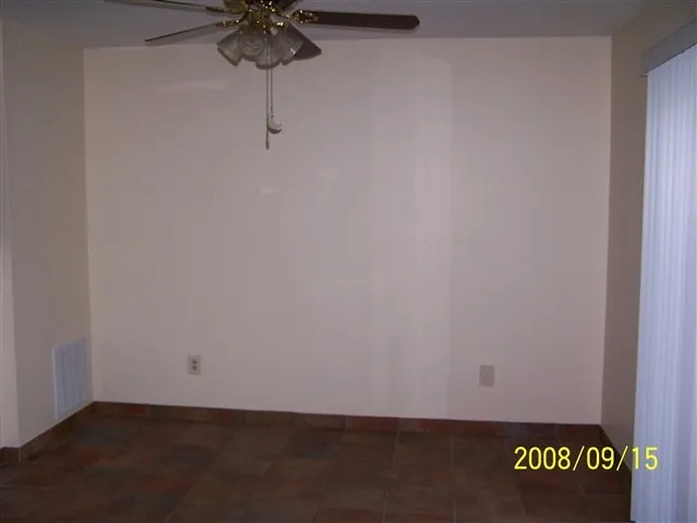 a view of room with fan and wooden floor