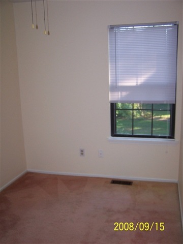 2606 Falcon Court, Unit 2606 Mays Landing, NJ 08330 - Photo 8 of 8 a view of an empty room with a window and a cabinet