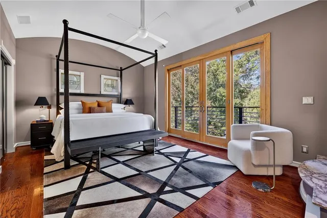 a bedroom with furniture and a fireplace