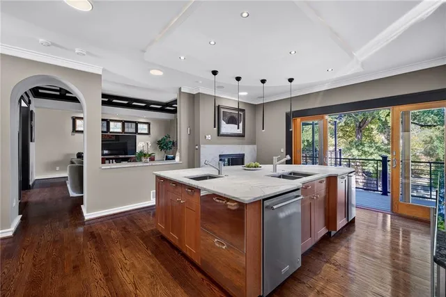 a kitchen with a large window and a kitchen view