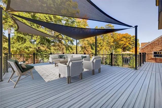 a balcony with furniture and wooden floor