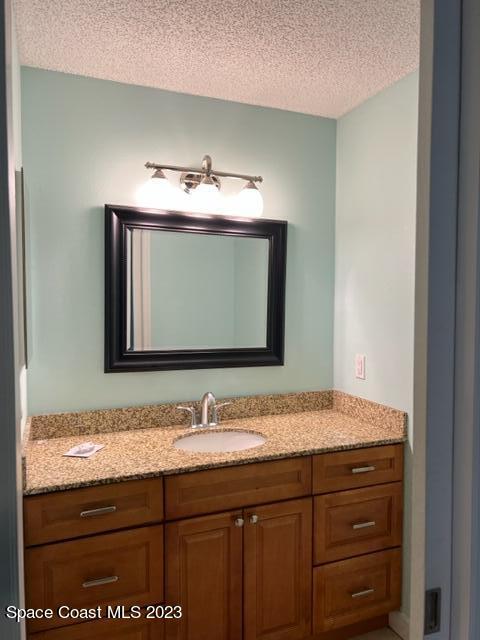 768 White Pine Avenue Rockledge, FL 32955 - Photo 7 of 9 a bathroom with a sink and a mirror