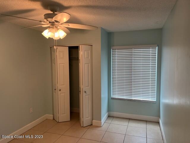 768 White Pine Avenue Rockledge, FL 32955 - Photo 8 of 9 a view of an empty room with window and chandelier fan