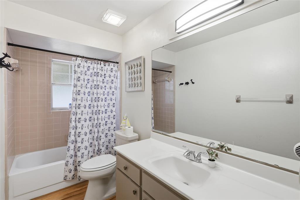244 Angeles Road DeBary, FL 32713 - Photo 21 of 41 a bathroom with a sink toilet and shower