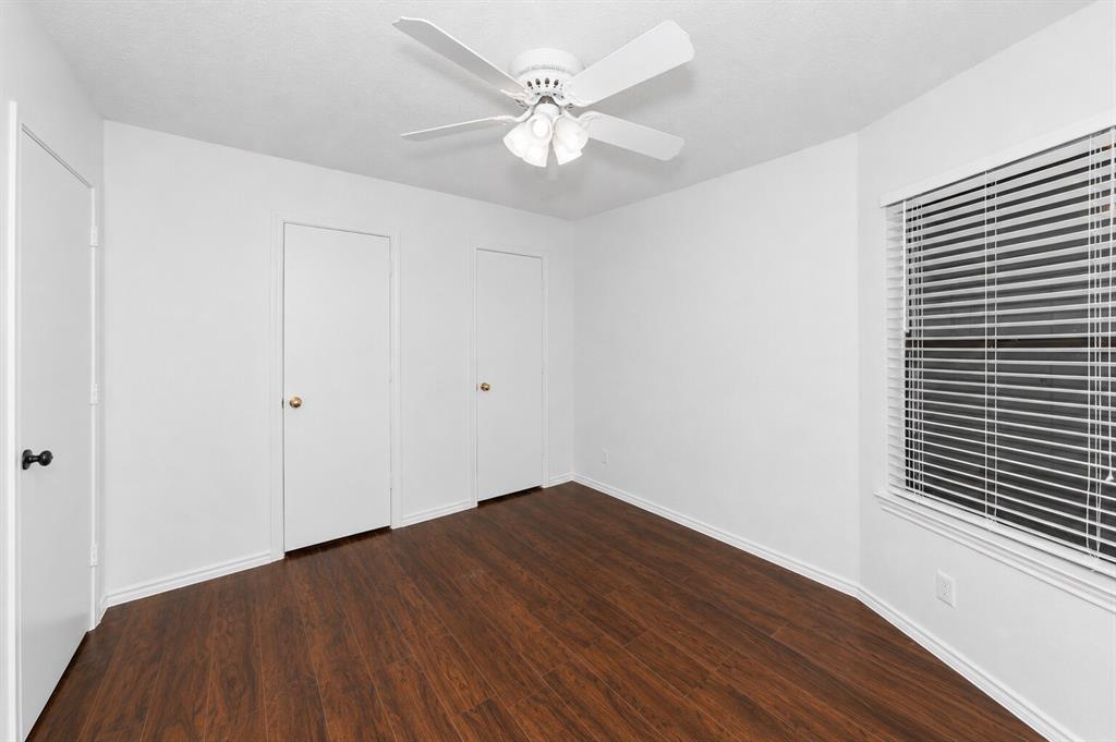 1001 Rosebud Drive Azle, TX 76020 - Photo 19 of 36 Interior room featuring wood-finish flooring, white walls, and a ceiling fan with light kit