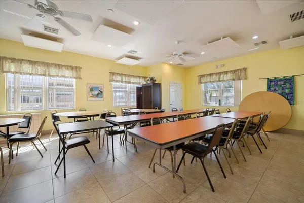 a room with furniture a large window and a table
