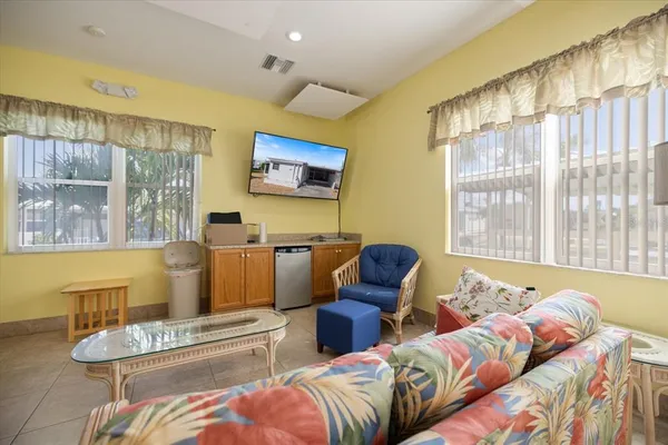 a living room with furniture and a large window
