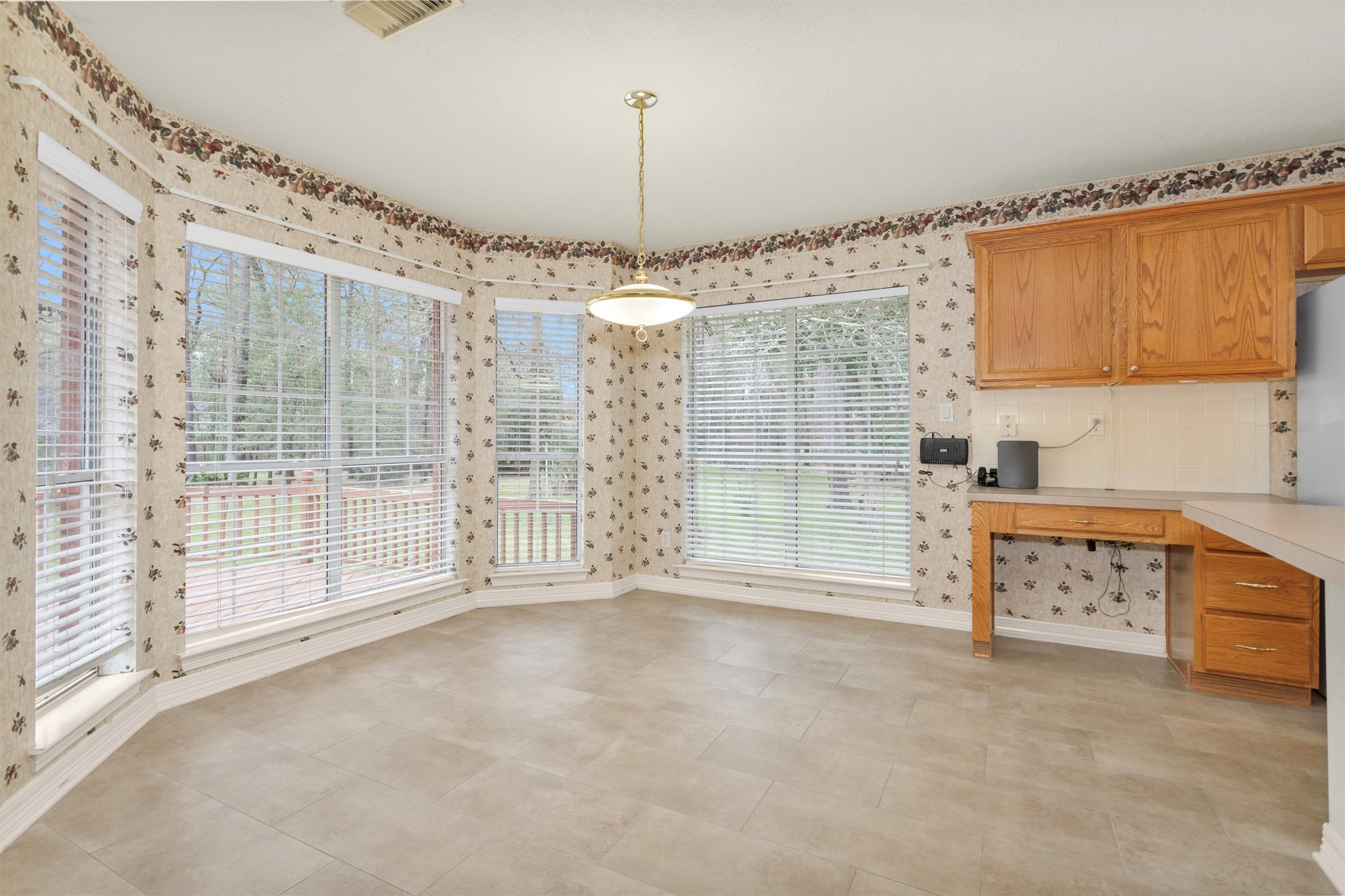 2419 Carriage Ridge Lane Conroe, TX 77384 - Photo 16 of 39 a view of a kitchen with appliances cabinets and a floor to ceiling window