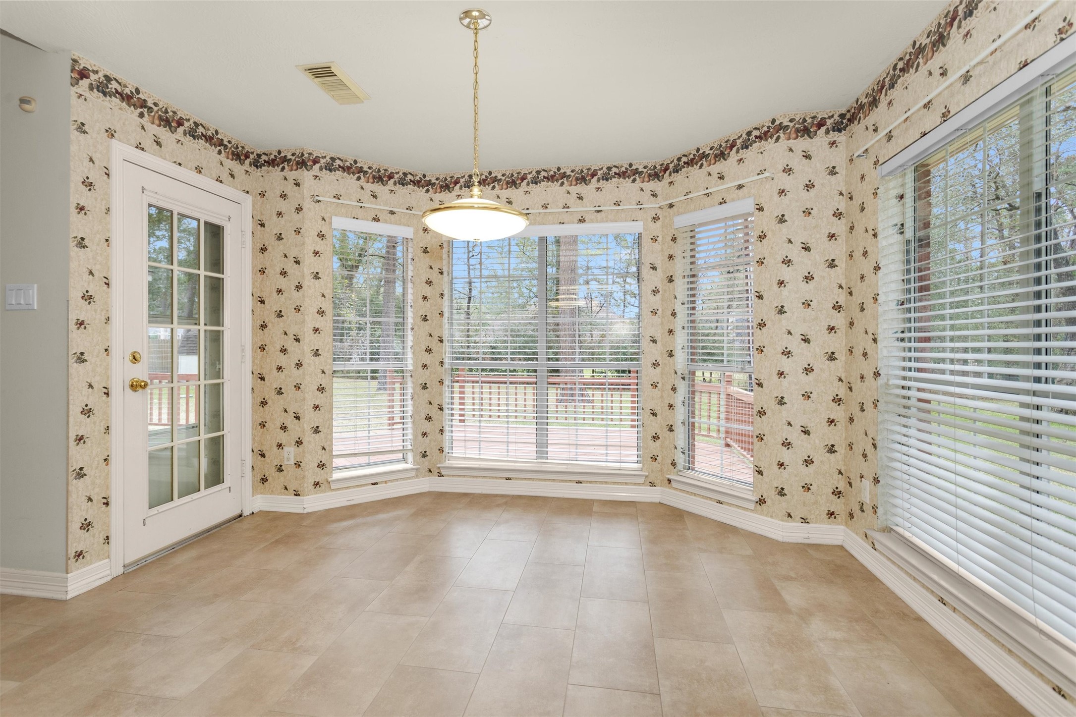 2419 Carriage Ridge Lane Conroe, TX 77384 - Photo 17 of 39 a view of a livingroom with a ceiling fan and window