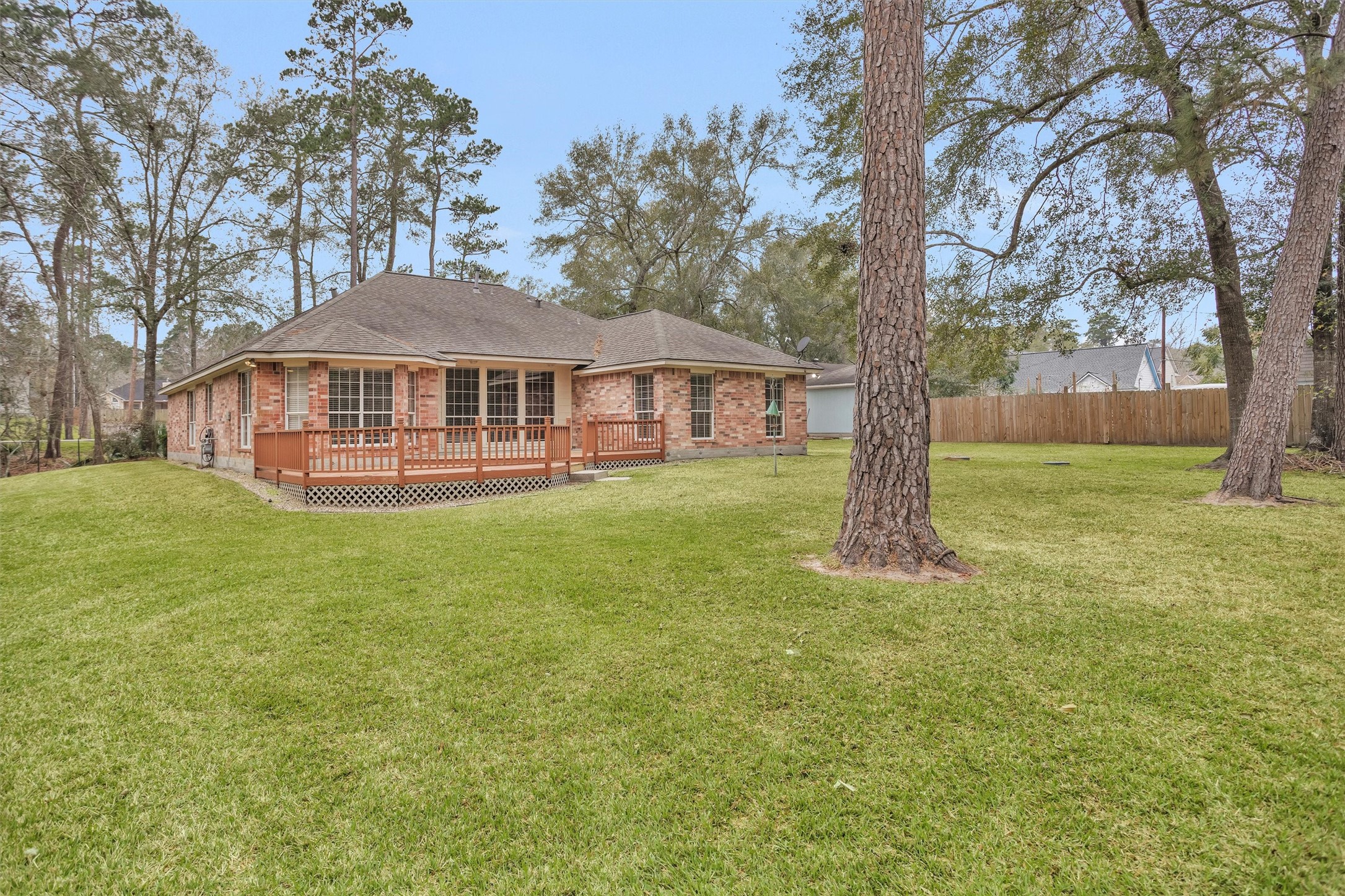2419 Carriage Ridge Lane Conroe, TX 77384 - Photo 38 of 39 a front view of a house with a yard