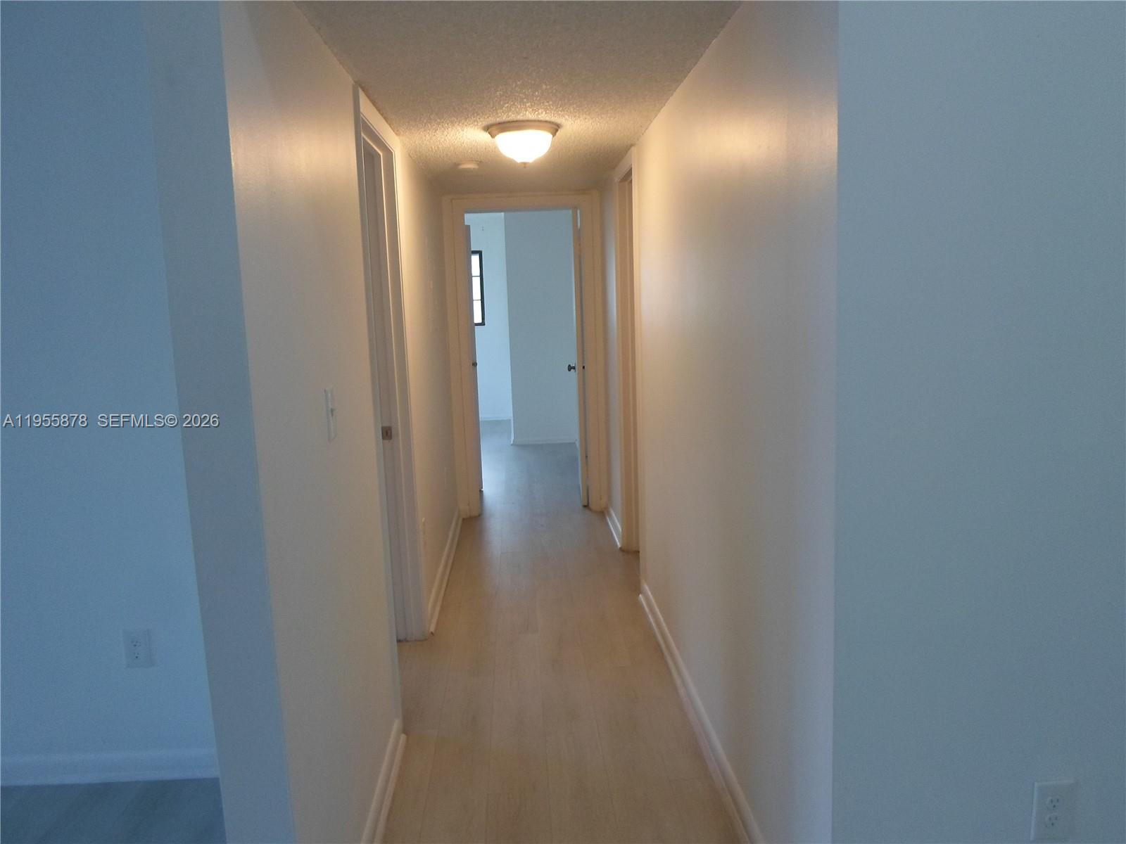 20760 Northeast 4th Court, Unit 201 Miami, FL 33179 - Photo 23 of 55 a view of a hallway