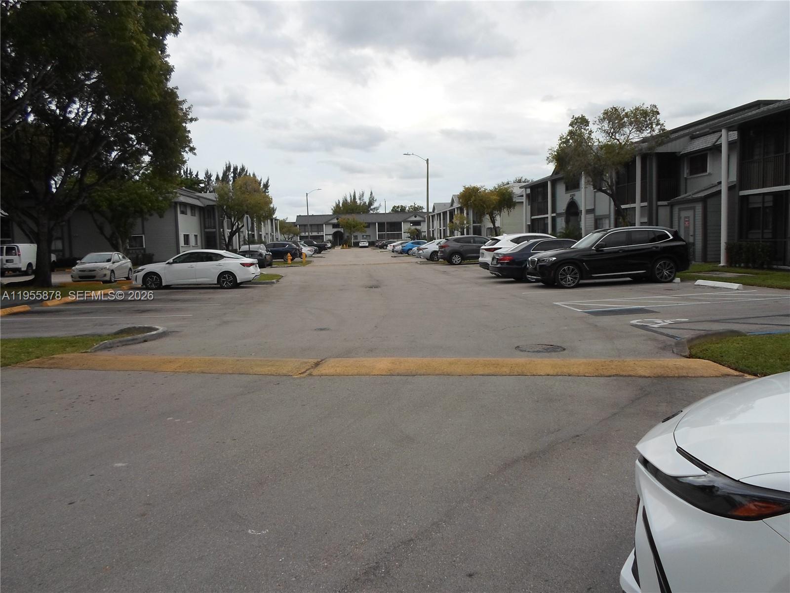 20760 Northeast 4th Court, Unit 201 Miami, FL 33179 - Photo 3 of 55 a view of road with card parked on the roadside