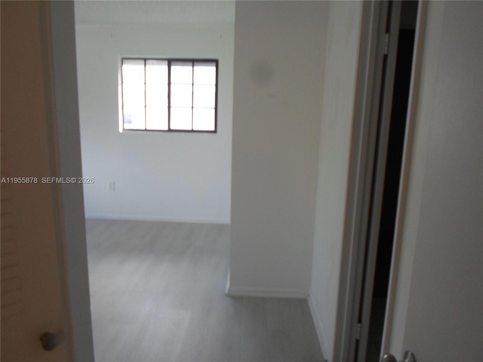 20760 Northeast 4th Court, Unit 201 Miami, FL 33179 - Photo 34 of 55 a view of a room that has a window