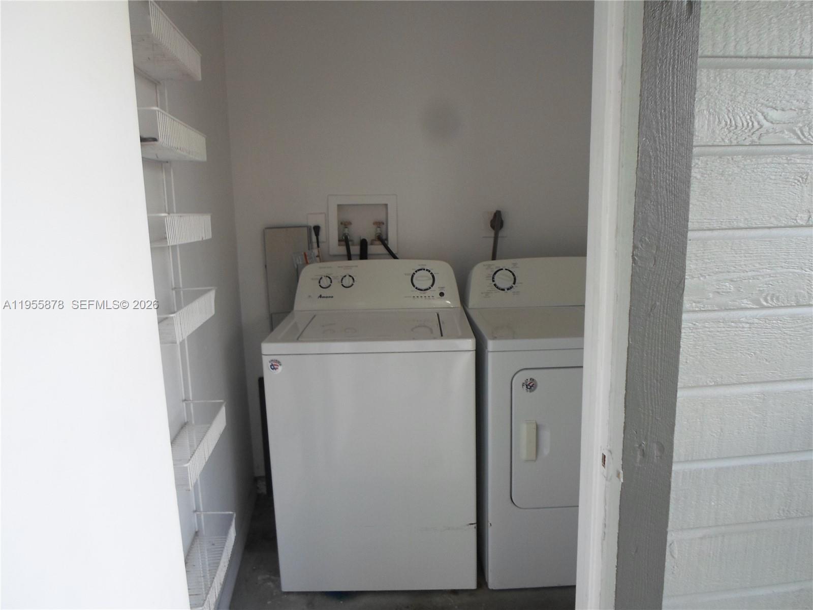 20760 Northeast 4th Court, Unit 201 Miami, FL 33179 - Photo 42 of 55 a utility room with dryer and washer