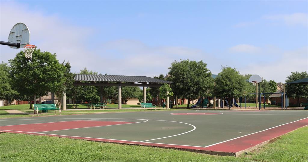 351 Wincliff Drive Buda, TX 78610 - Photo 40 of 40 An inviting neighborhood park features a half-court basketball setup with a shaded pavilion.