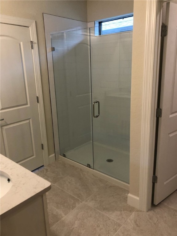 5288 Jasper Square Vero Beach, FL 32967 - Photo 12 of 14 a bathroom with a shower and a sink