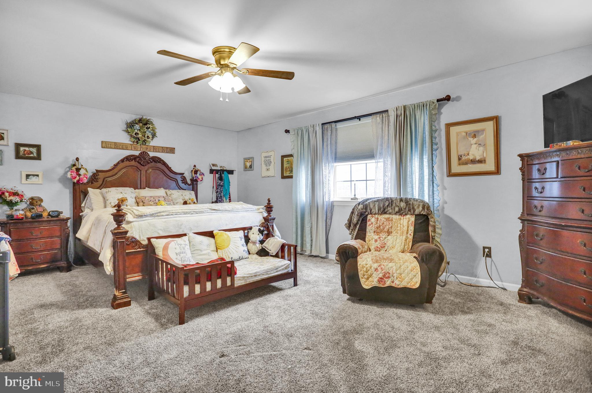 13 Roxberry Drive Reading, PA 19608 - Photo 13 of 24 a bedroom with furniture and a chandelier