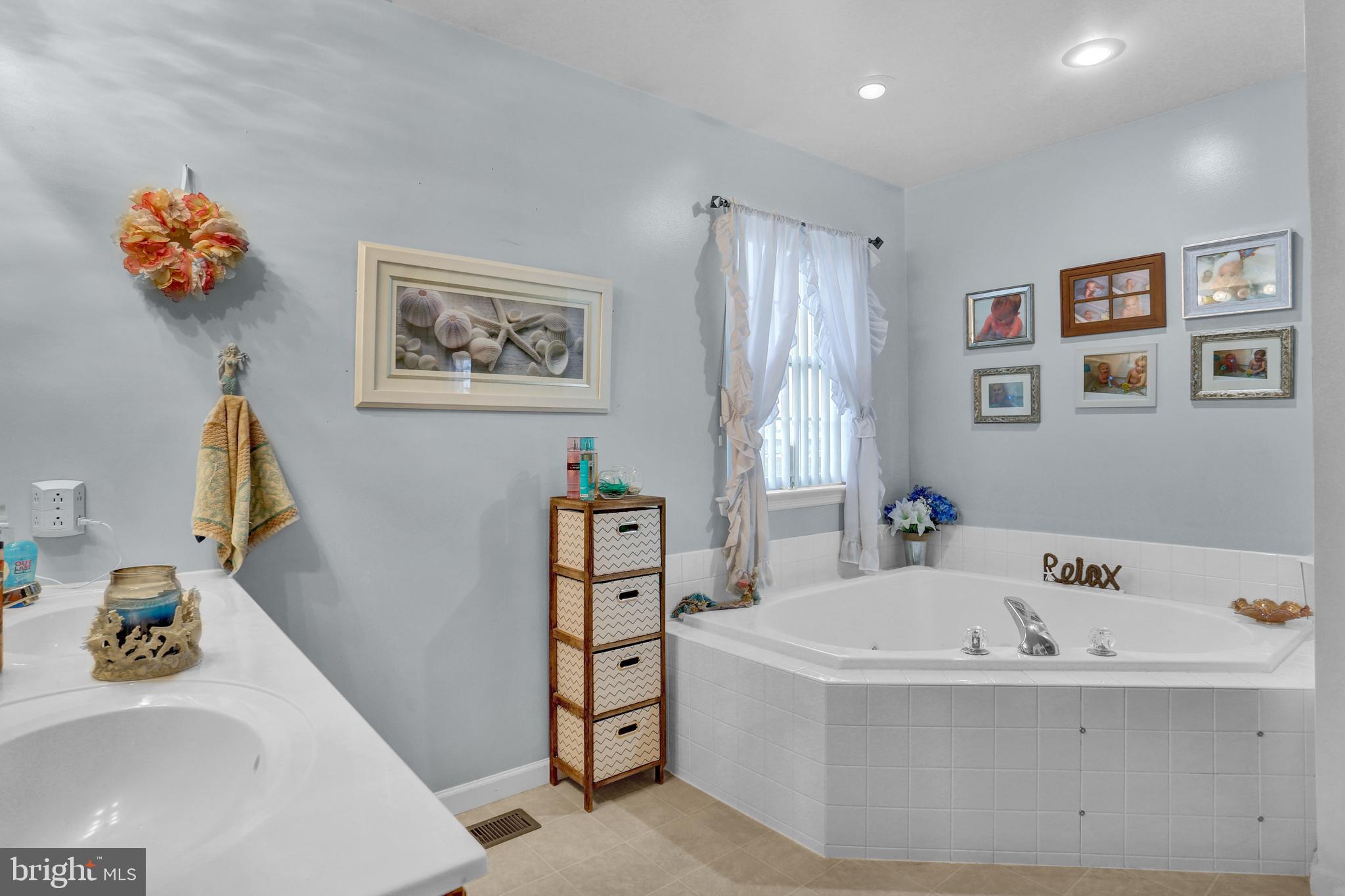 13 Roxberry Drive Reading, PA 19608 - Photo 16 of 24 a bathroom with a tub sink and mirror
