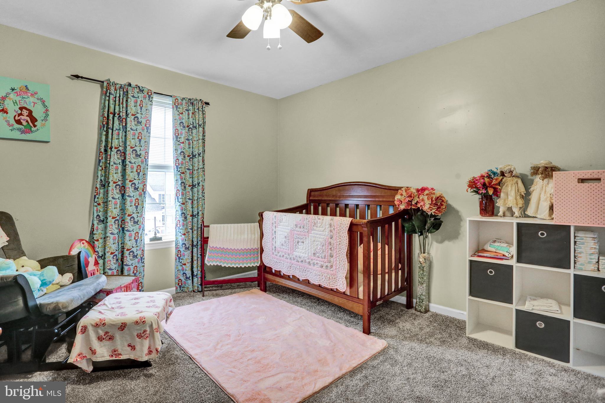 13 Roxberry Drive Reading, PA 19608 - Photo 20 of 24 a bedroom with a bed and a chandelier