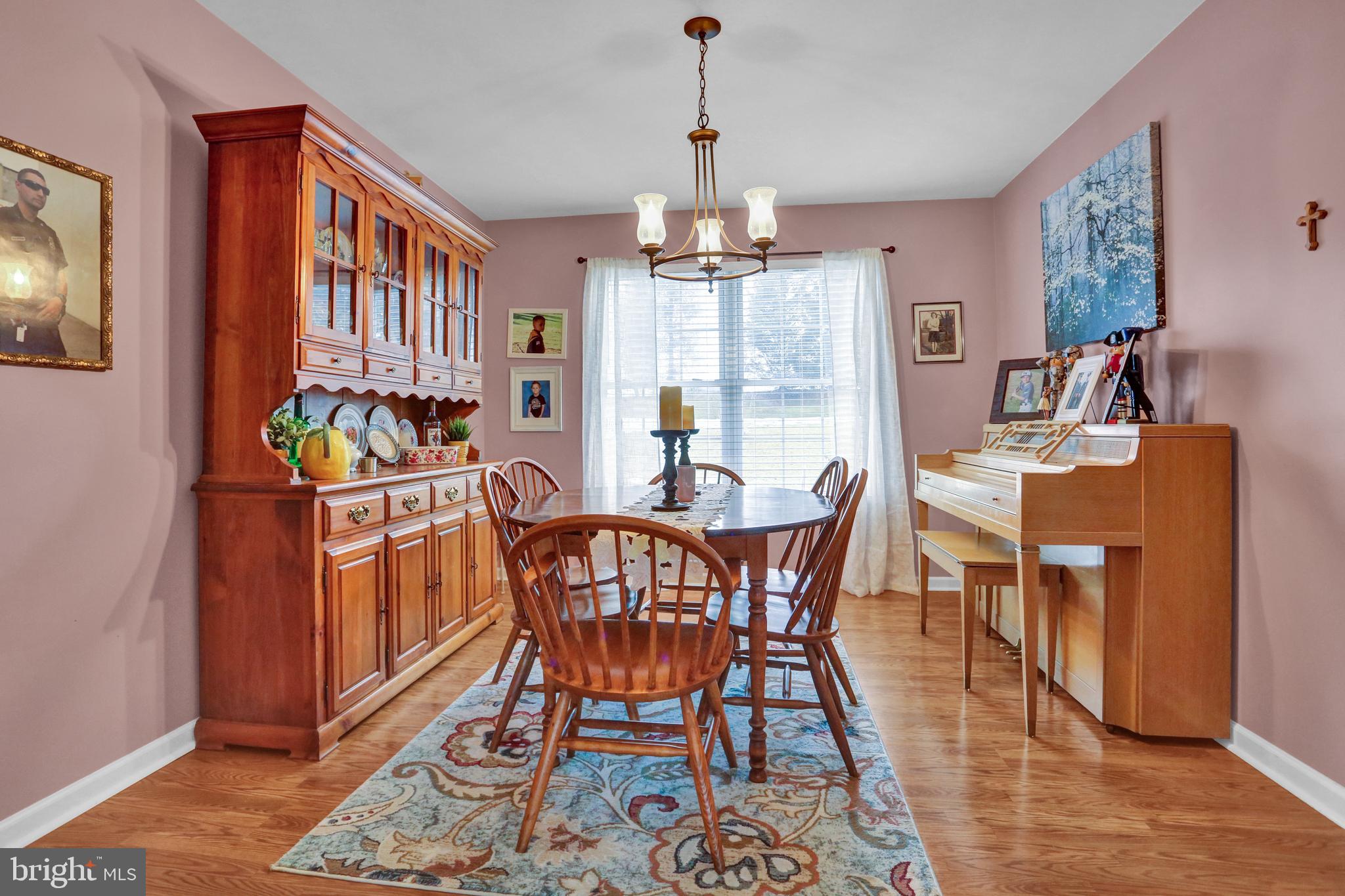13 Roxberry Drive Reading, PA 19608 - Photo 4 of 24 a dining room with furniture a chandelier and wooden floor