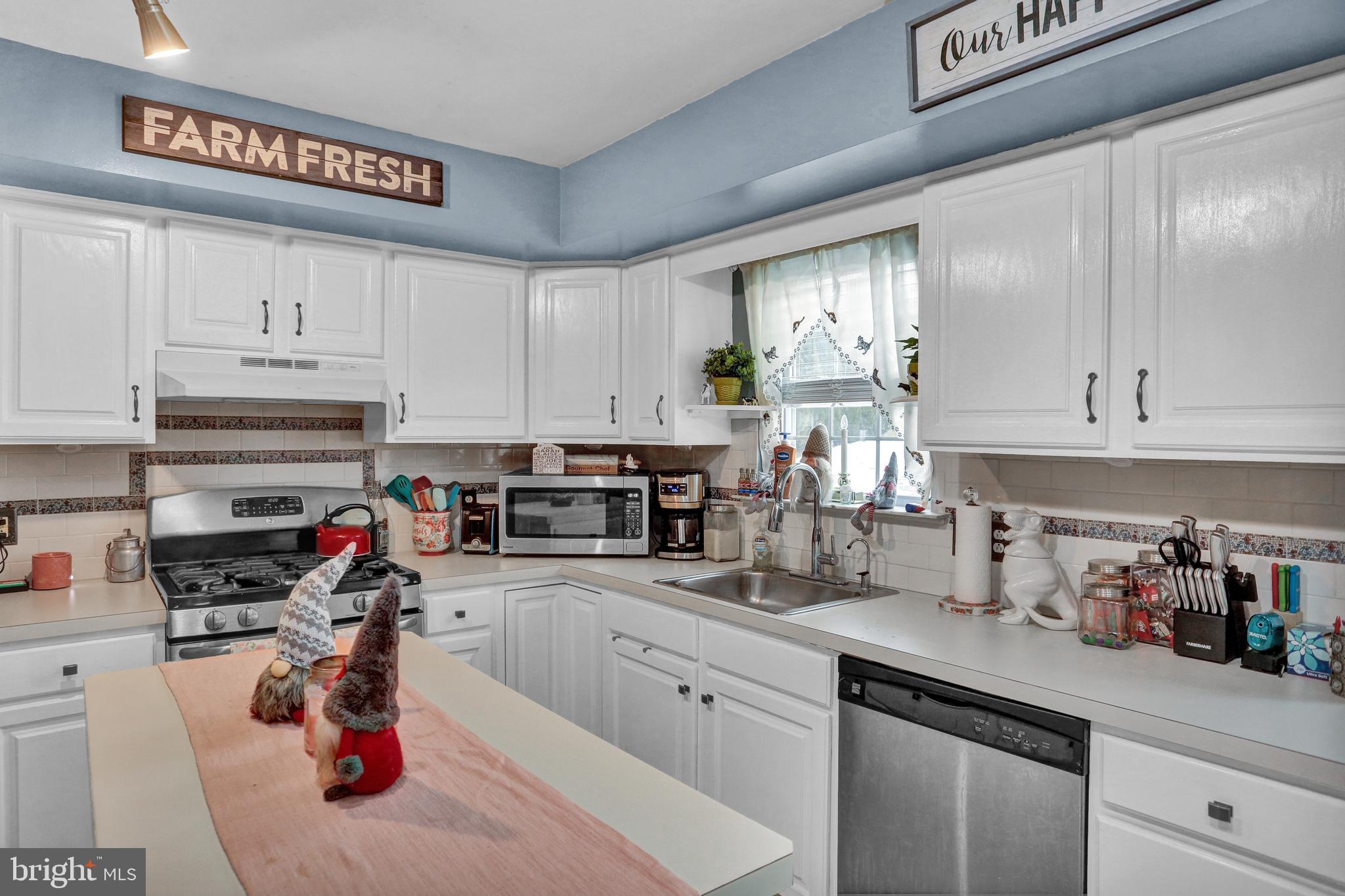 13 Roxberry Drive Reading, PA 19608 - Photo 8 of 24 a kitchen with stainless steel appliances granite countertop a sink a stove and cabinets