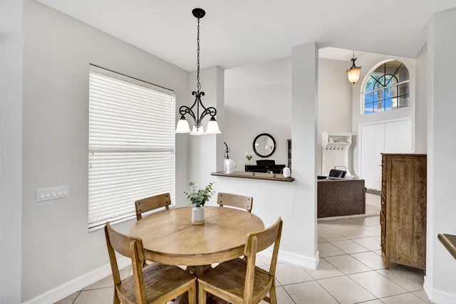 a kitchen with stainless steel appliances granite countertop a sink a stove and a refrigerator with wooden floor