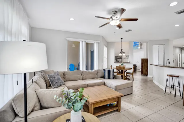 a bathroom with a granite countertop double vanity sink and mirror