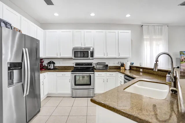 a bathroom with a sink toilet and a mirror