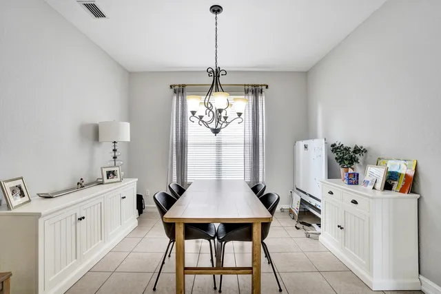 a spacious bathroom with a tub sink and mirror