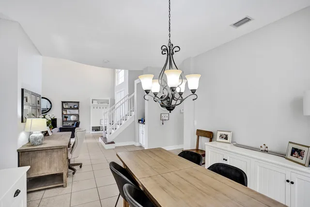 a bed sitting in a room next to a window