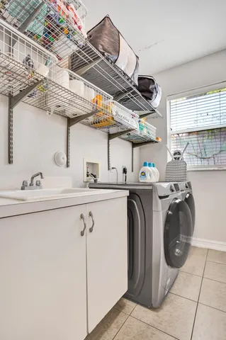 a bathroom with a double vanity sink toilet and shower