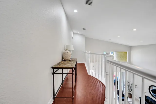 a view of a lake with houses in the back