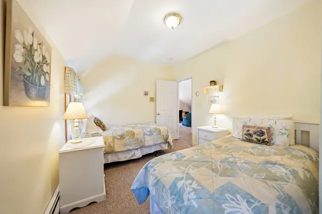 a bedroom with two beds and painted walls