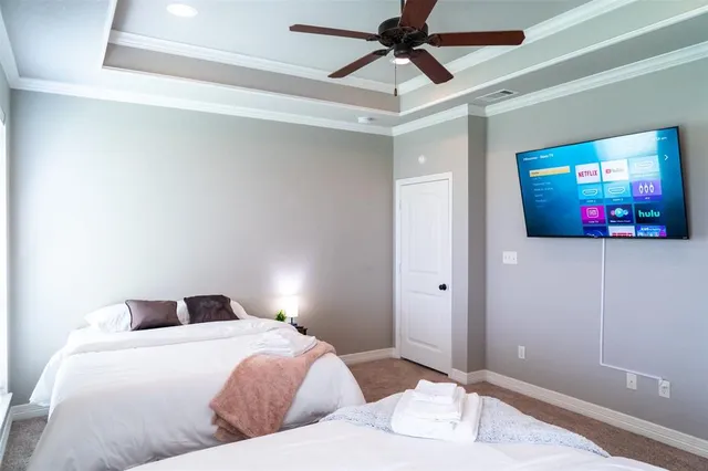 a bedroom with a bed and a painting on the wall