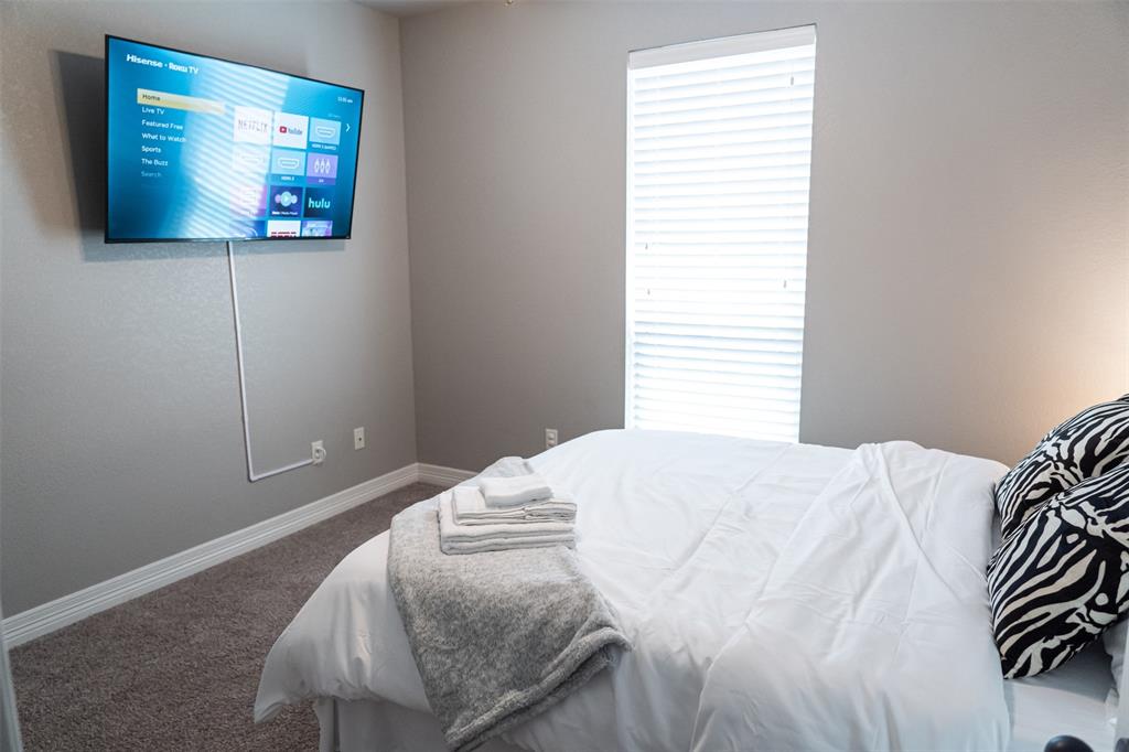 7352 Kingsport Lane Tyler, TX 75703 - Photo 23 of 38 a bedroom with a bed and a window