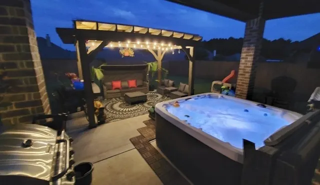 a room with furniture a flat screen tv and a fireplace