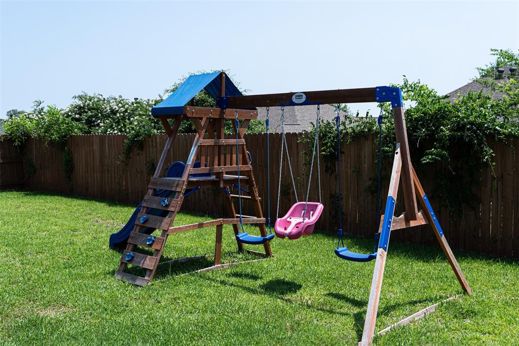 7352 Kingsport Lane Tyler, TX 75703 - Photo 31 of 38 a small hurt is sitting in the grass