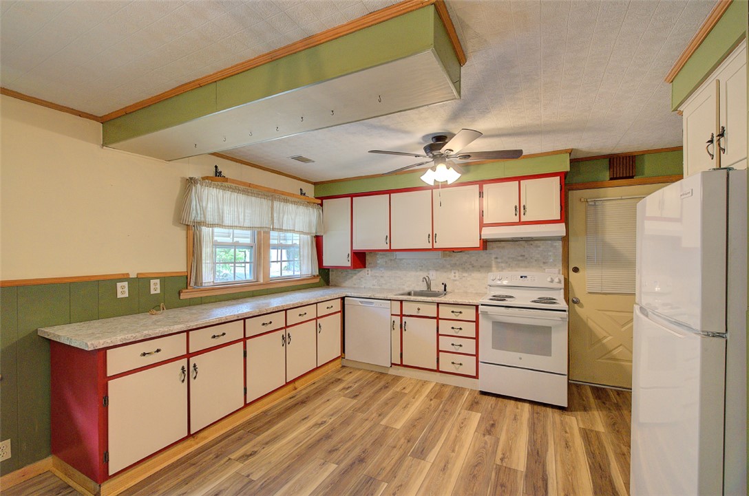 5064 Keowee School Road Seneca, SC 29672 - Photo 17 of 49 This spacious kitchen offers ample cabinetry and counter space, perfect for culinary endeavors.