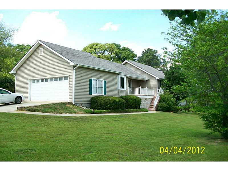 3315 Caleb Road Southwest Snellville, GA 30039 - Photo 1 of 1 Exterior Front. Home on the range! Almost 5 acre ranch home on full basement with stable/barn and in-ground pool.